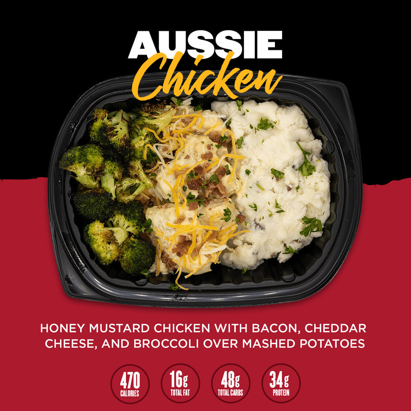 Image of Clean Eatz Kitchen's Aussie Chicken meal featuring honey mustard chicken topped with bacon and cheddar cheese, served with broccoli and mashed potatoes. Nutritional details: 470 calories, 16g total fat, 48g total carbs, and 34g protein.