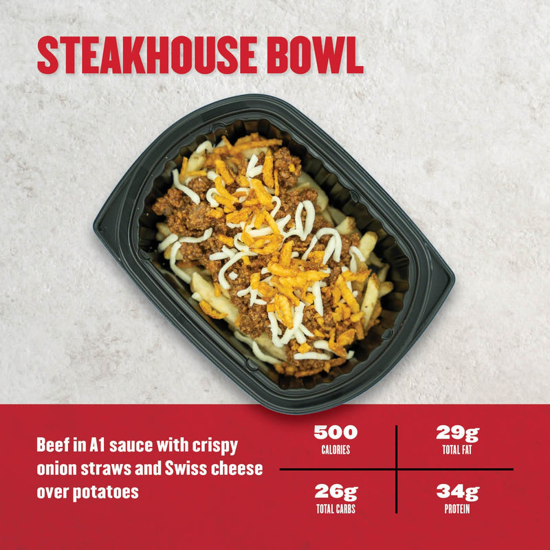 Clean Eatz Kitchen Steakhouse Bowl with beef in A1 sauce, crispy onion straws, and Swiss cheese over potatoes. A savory, protein-packed meal.