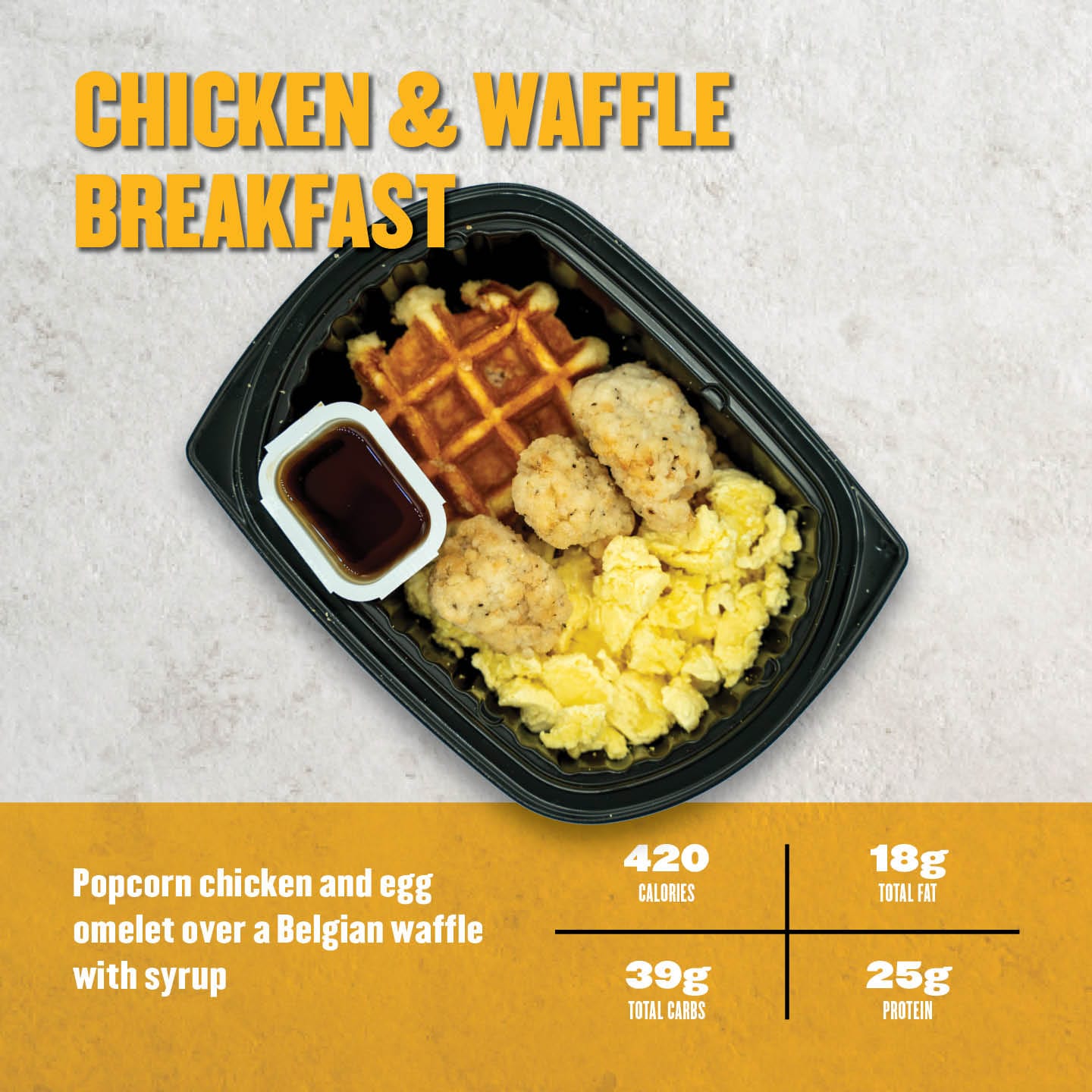 Clean Eatz Kitchen Chicken & Waffle Breakfast with popcorn chicken, egg omelet, Belgian waffle, and syrup. A high-protein, balanced breakfast option