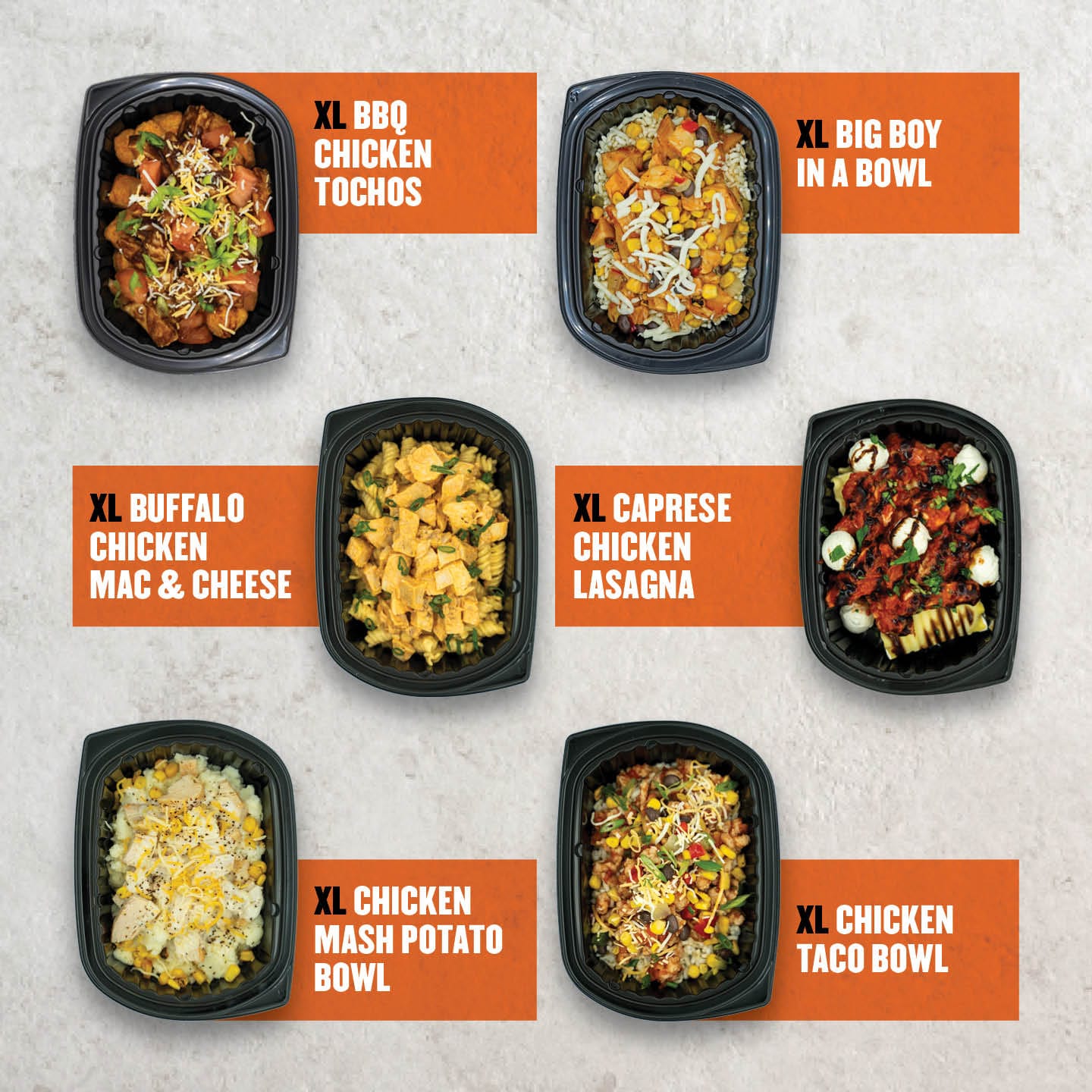 XL-sized high-protein meal options from Clean Eatz Kitchen, including BBQ chicken totchos, buffalo chicken mac and cheese, caprese chicken lasagna, and mashed potato bowls, packed in black meal containers.